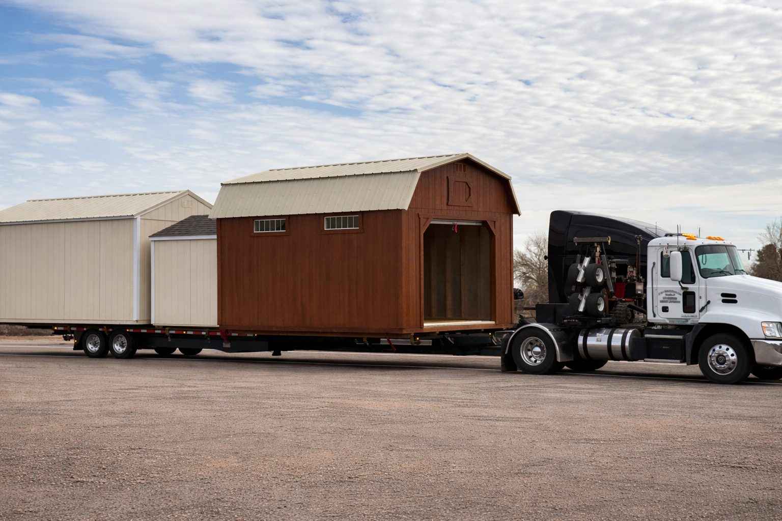 Portable building transport on trailer